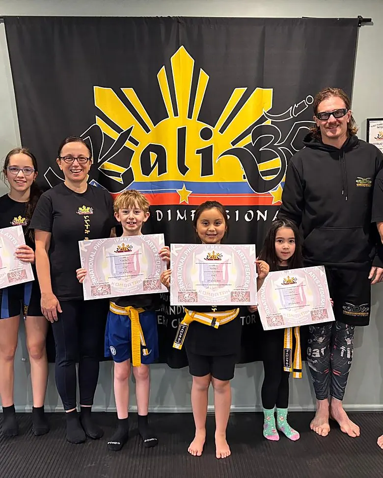 Kids Kali grading day — students receiving IPMAF certificates
