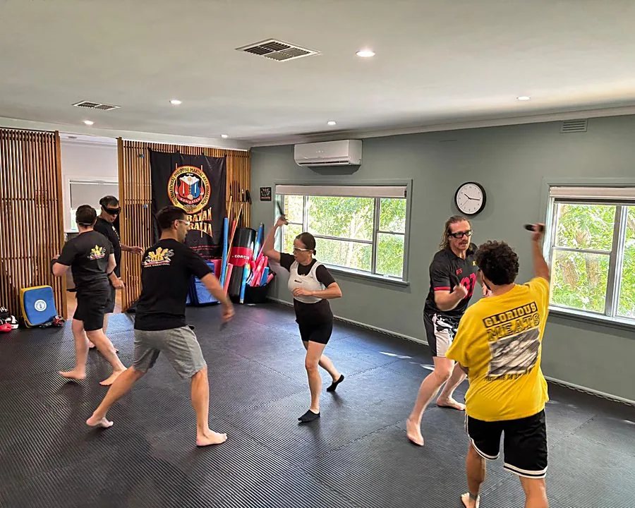 Adult students drilling together during a class at Kali 3D Ashburton