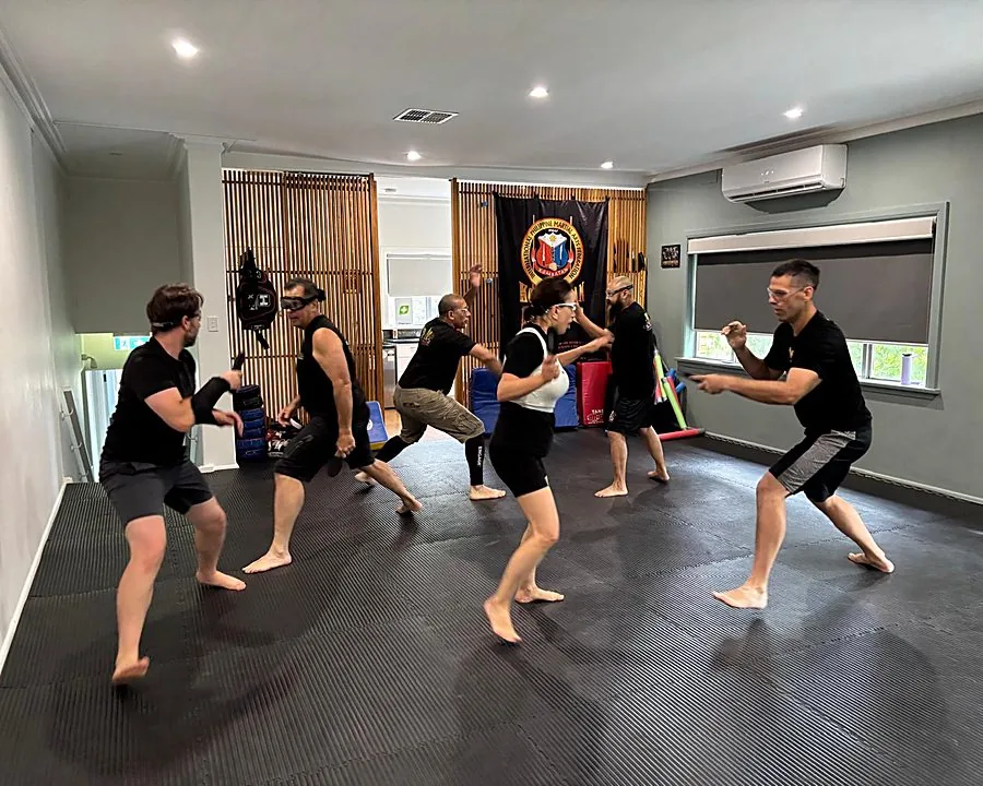 A beginners class training together on the mats at Kali 3D Ashburton